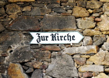 Close-up of text on stone wall