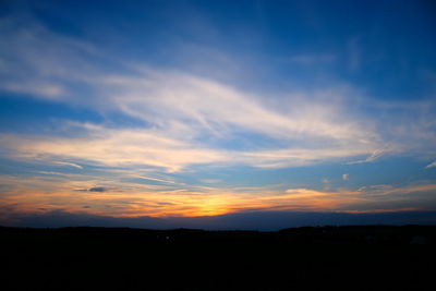 Scenic view of silhouette landscape against sky during sunset