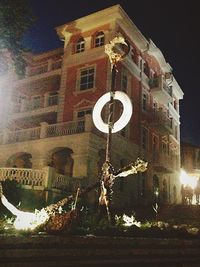 Low angle view of illuminated street light at night