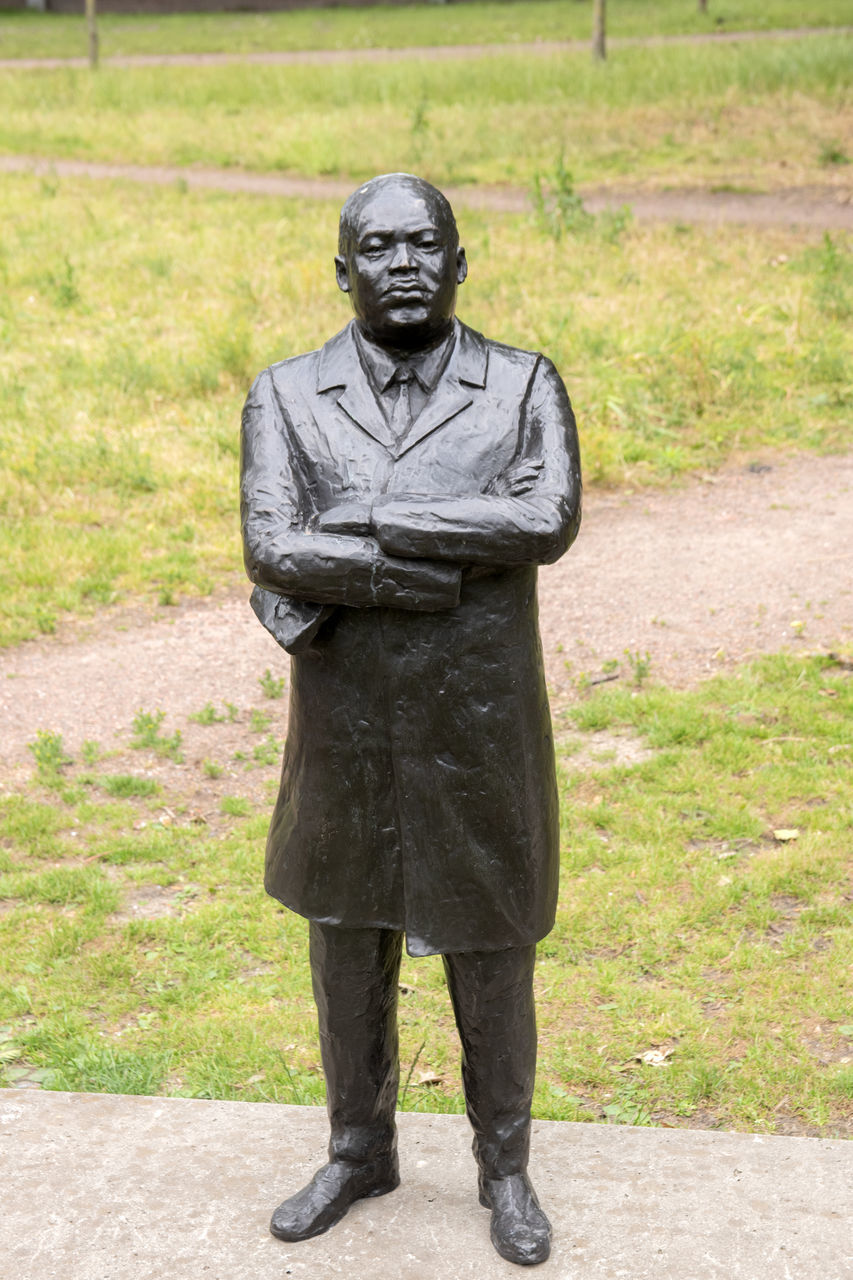 FULL LENGTH PORTRAIT OF A MAN STANDING IN SCULPTURE