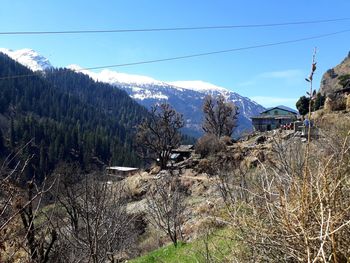 Scenic view of mountains against sky during winter