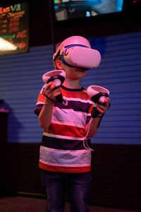 Vr game and virtual reality. kid boy gamer six years old fun playing on simulation video game