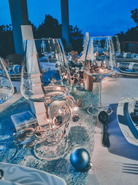 Glass of bottles on table at restaurant