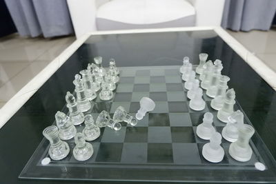 High angle view of chess pieces on table