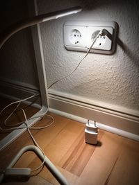Illuminated electric lamp on wall