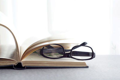 Close-up of eyeglasses on table