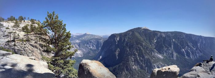 Scenic view of rocky mountains against clear blue sky