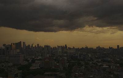 Cityscape against dramatic sky