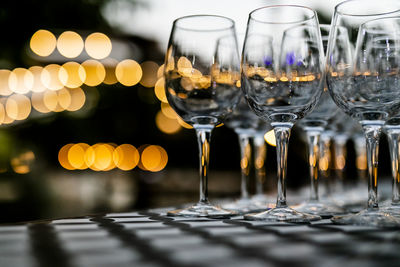 Close-up of wine glasses on table