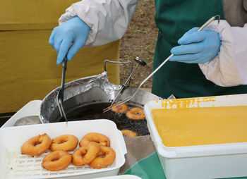 Close-up of people preparing food