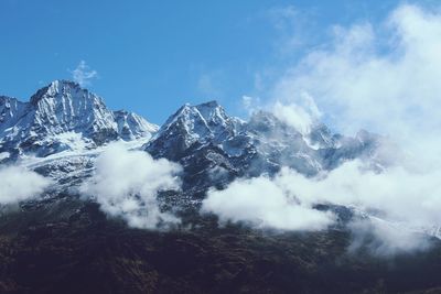 Low angle view of mountain range against sky
