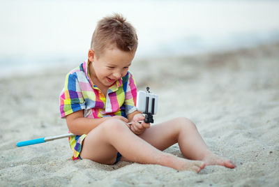 Boy playing on beach