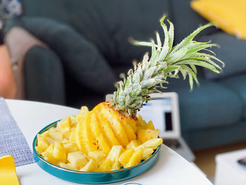 Close-up of fresh pineapples in plate on table