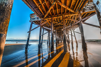 Pier over sea against sky