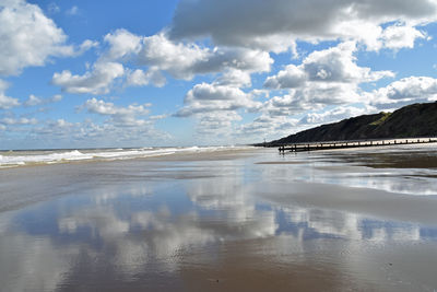 Scenic view of beach against sky