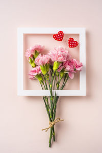 Close-up of pink flowers on table