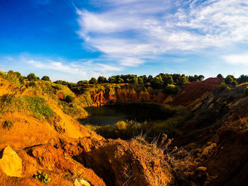 Scenic view of rock formations against sky