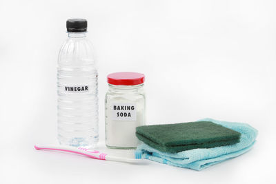 High angle view of bottles against white background