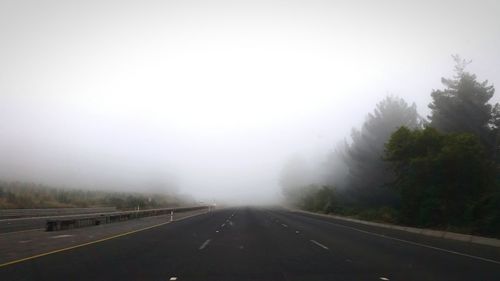 Empty road in foggy weather