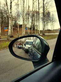 Reflection of car on side-view mirror