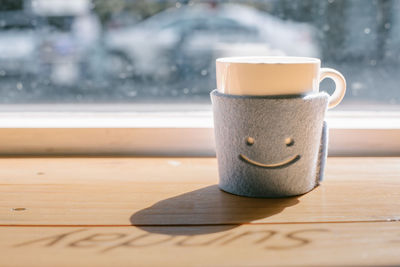 Close-up of coffee cup on table