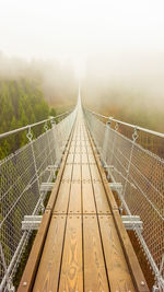 Footbridge in foggy weather