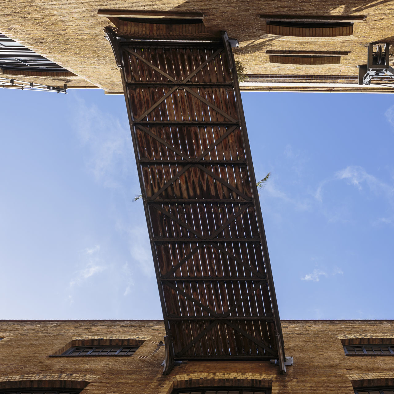 built structure, architecture, sky, building exterior, low angle view, nature, day, cloud - sky, no people, building, outdoors, old, window, roof, wood - material, house, residential district, sunlight, metal, wall - building feature