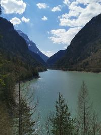 Scenic view of lake and mountains against sky