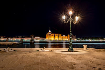 Illuminated buildings in city at night