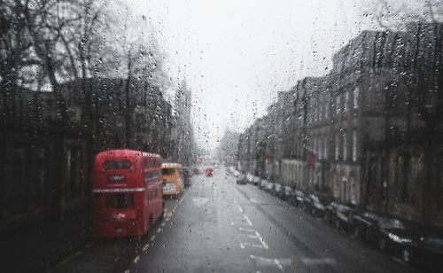 Full frame shot of wet bus window during rainy season