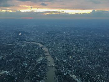 High angle view of cityscape against sky at sunset