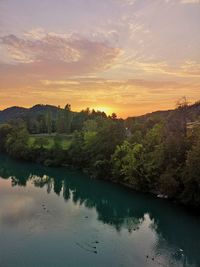 Scenic view of lake against sky during sunset