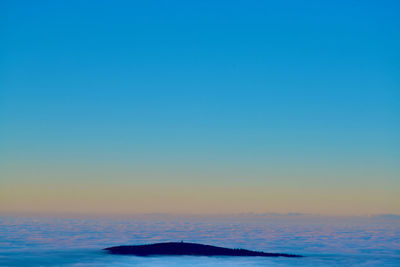 Scenic view of sea against clear sky during sunset