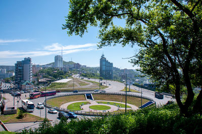 High angle view of trees and buildings in city