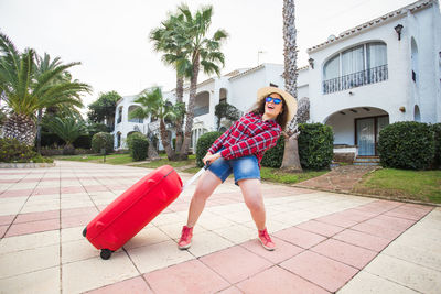 Full length of woman on palm trees