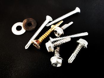High angle view of equipment on table against black background