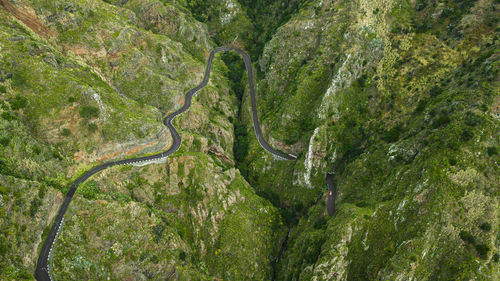 Drone top view of bended road on mountain of paul do mar village in madeira island 