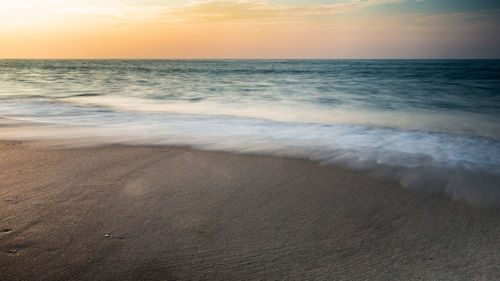 Scenic view of sea against dramatic sky