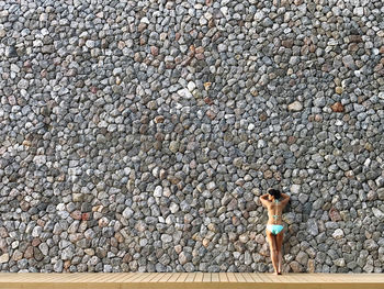 High angle view of woman standing on stone