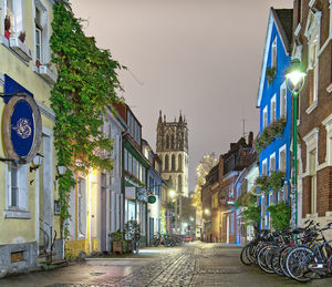 Street amidst buildings against sky