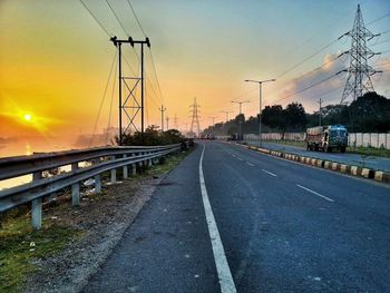 Empty road at sunset