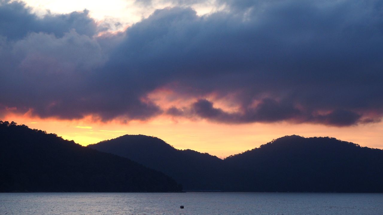 silhouette, sunset, cloud - sky, sky, beauty in nature, nature, mountain, dramatic sky, reflection, scenics, mountain range, outdoors, tranquil scene, no people, water, day