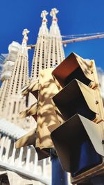 Low angle view of building against blue sky