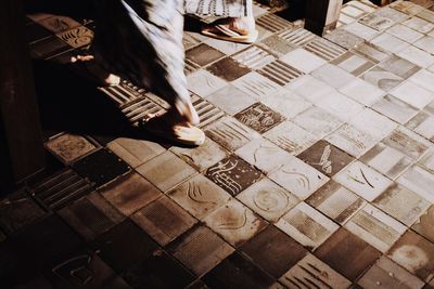 Low section of man standing on floor