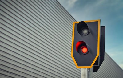 Close up of a train traffic light which is set to red