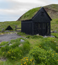 House on field against sky