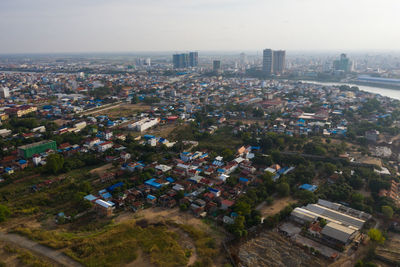 High angle view of buildings in city against sky