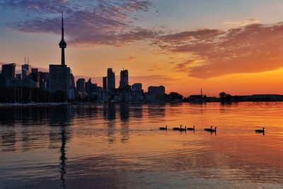 View of buildings in city during sunset