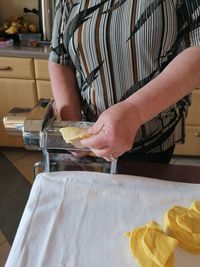 Midsection of man preparing food