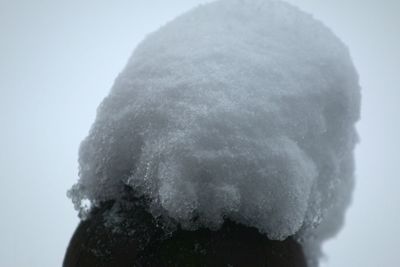 Close-up of ice against sky